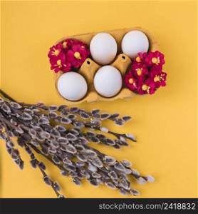 white eggs rack with willow branches table