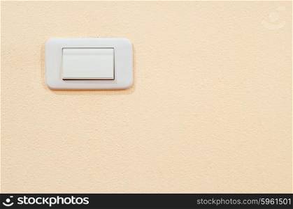 white electric switch on a wall