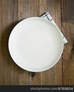 white empty plate on wooden background