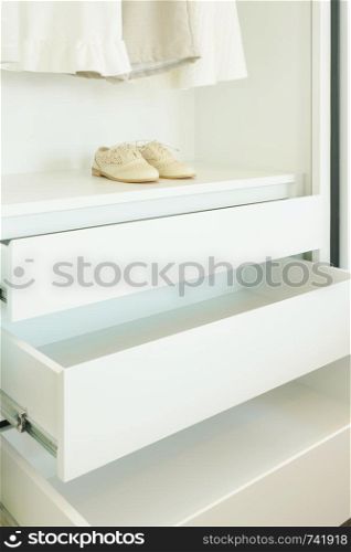 White empty wardrobe withe shoe and cloths