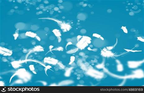 White feathers. Abstract background image of feathers flying in air