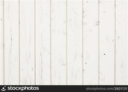 white fence made out of vertical wooden planks