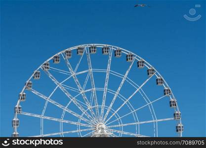 White ferris wheel on Steel Pier in Atlantic City on the New Jersey coast. White ferris wheel on Steel Pier in Atlantic City on New Jersey coastline