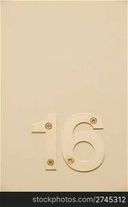 white flat number hanging on the door