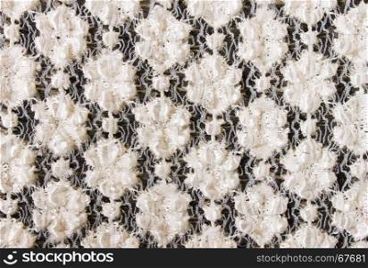 White Flower Knitting Pattern on Black Fabric Texture Background. Knitting background or knitted texture background
