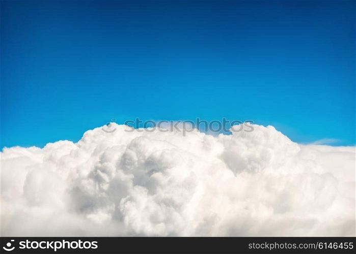 White fluffy clouds and blue sky. Natural background