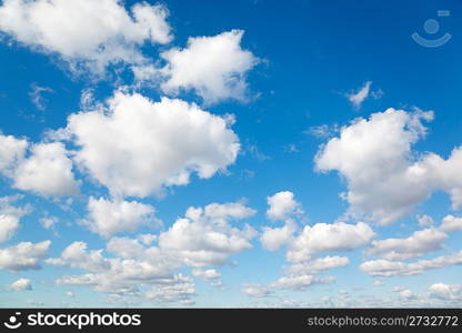 White, fluffy clouds in blue sky. Background from clouds.