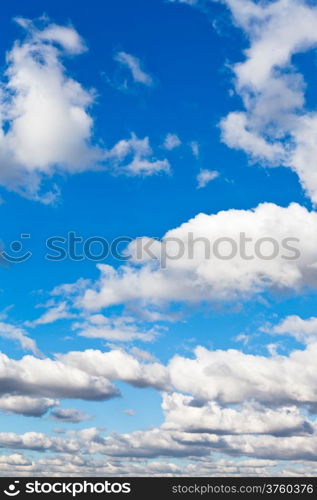 white fluffy clouds in blue spring sky