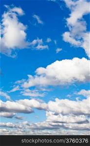 white fluffy clouds in blue spring sky