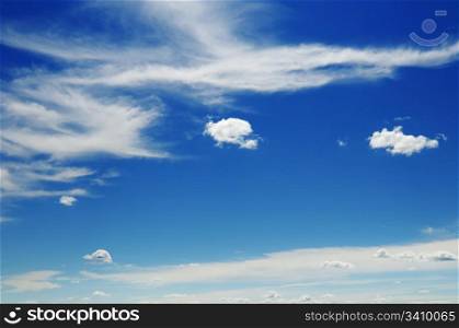 white fluffy clouds in the blue sky