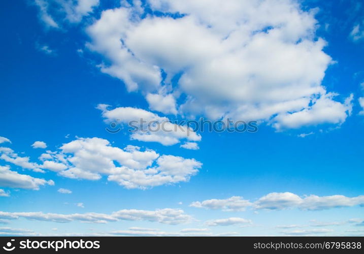 white fluffy clouds in the blue sky