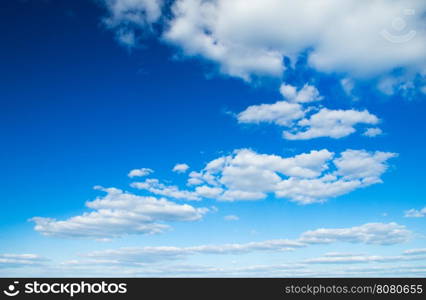 white fluffy clouds in the blue sky