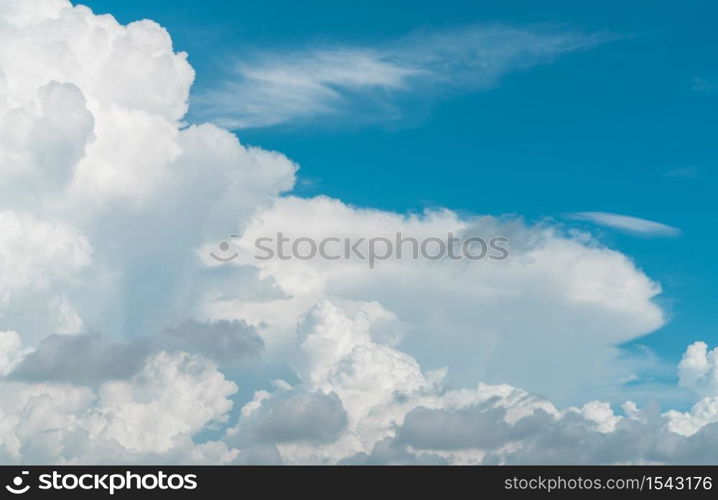 White fluffy clouds on blue sky. Soft touch feeling like cotton. White puffy clouds cape with space for text. Beauty in nature. Close-up white cumulus clouds texture background. Sky on sunny day.