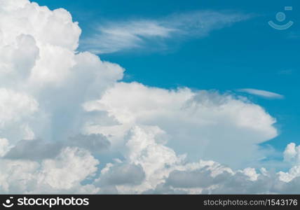 White fluffy clouds on blue sky. Soft touch feeling like cotton. White puffy clouds cape with space for text. Beauty in nature. Close-up white cumulus clouds texture background. Sky on sunny day.