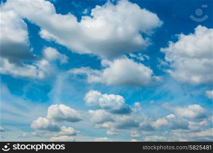 White fluffy clouds on the blue sky. Nature background