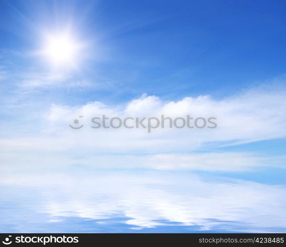 white fluffy clouds with rainbow in the blue sky