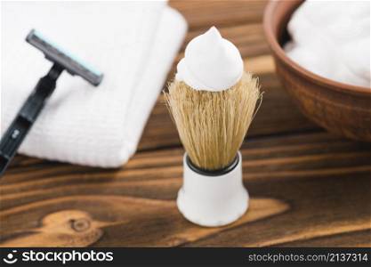 white foam shaving brush with razor napkin foam desk