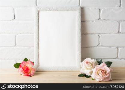 White frame mockup with roses. Empty white frame mockup for design presentation. Portrait or poster white frame romantic style mockup. Romantic style white frame mockup with roses
