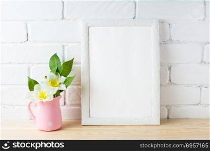 White frame mockup with rustic pink flower pot. Portrait or poster white frame mockup. Empty white frame mockup for presentation artwork design.. White frame mockup with rustic pink flower pot