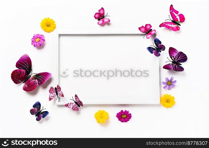 White frame mockup with vivid violet butterflies and flowers. Color trends of 2022. Copy space. Spring or Easter holidays. White frame mockup with butterflies and flowers