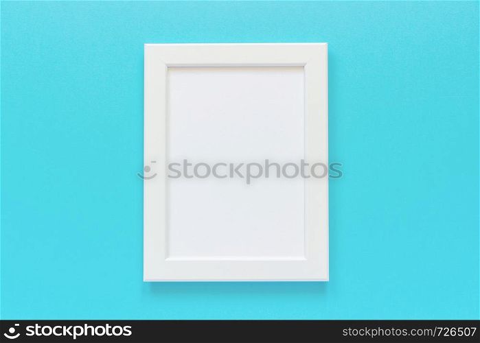 White frame with empty card on blue background. Creative Flat lay Top view Mockup Copy space for text.. White frame with empty card on blue background. Creative Flat lay Top view Mockup Copy space for text