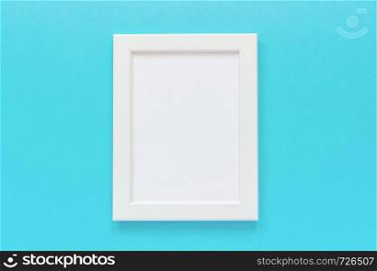 White frame with empty card on blue background. Creative Flat lay Top view Mockup Copy space for text.. White frame with empty card on blue background. Creative Flat lay Top view Mockup Copy space for text