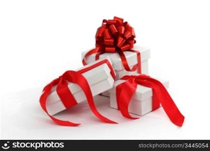 white gift with red ribbon