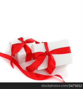 white gift with red ribbon