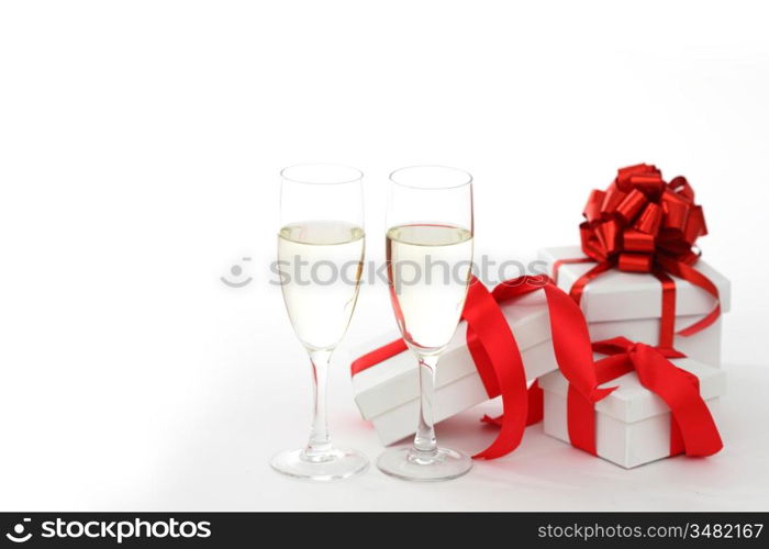 white gift with red ribbon