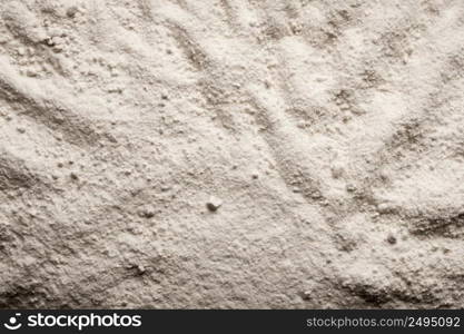 White granular material background with abstract seam≤ss pattern.