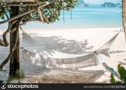white hammock on the paradise beach. vacation, travel, summer, Wanderlust and holiday concept