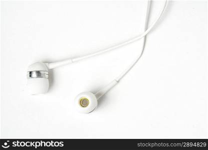White headphones on light background