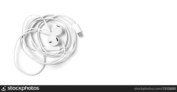 White headphones with headset lie on white isolated background