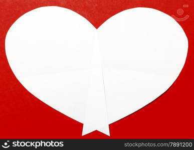 White heart paper on red background. Valentine&rsquo;s Day or holiday greeting card. Heart shape symbol frame.