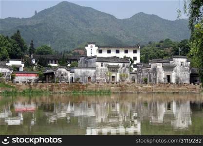 White houses near the lake in Shexian town, China