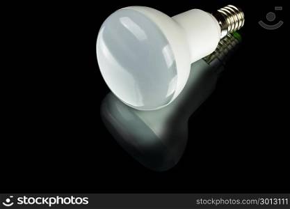white innovation energy-saving LED bulb on black background