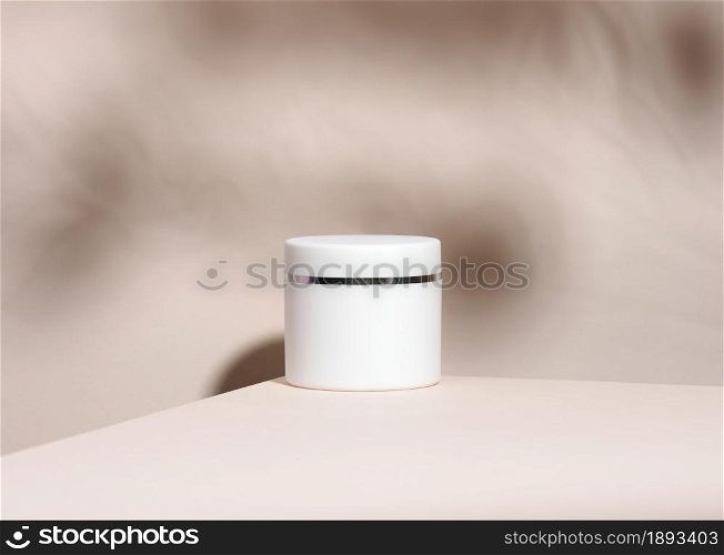 white jar for cosmetics on a beige table. Packaging for cream, gel, serum, advertising and product promotion, mock up