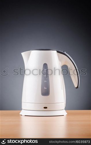 White kettle against grey background