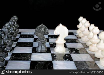 White Knight vs. Black Knight on a marble chess board