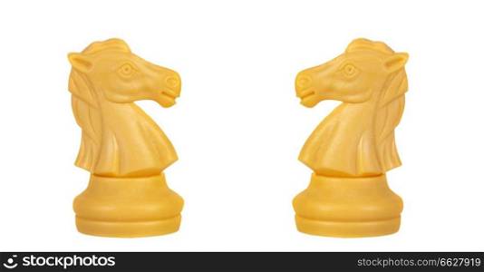 White knights face to face. Symmetrical pieces of chess