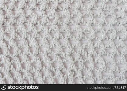 White Knitting Pattern or Knitted Pattern Background in macro style. Knitting Pattern or Knitted Pattern in vintage style for design