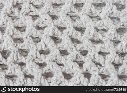 White Knitting Texture or Knitted Texture Background in macro style. Knitting Texture or Knitted Texture in vintage style for design