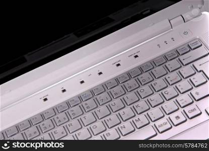 White laptop keyboard detail. Shallow depth of field