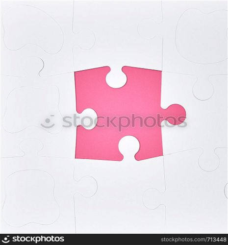 white large blank puzzles on a pink background, top view, copy space
