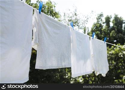white laundry hanging string outdoors