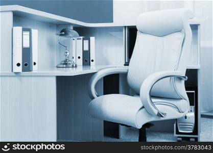 white leather armchair in a modern office