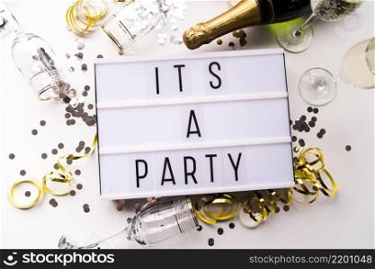 white light box with it s party text champagne bottle white backdrop