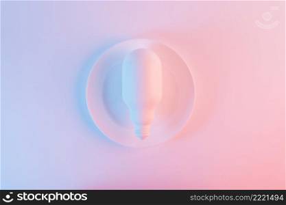 white light bulb plate against blue pink background