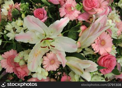 white lilies and pink gerberas and roses in a bridal flower arrangement