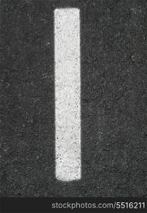 White line painted on the asphalt road